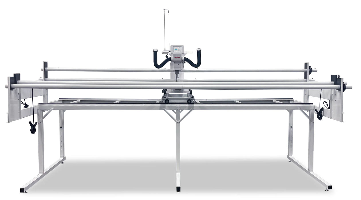 Close-up of Janome Quilt Maker 15 long arm quilting machine stitching a geometric quilt design on frame system