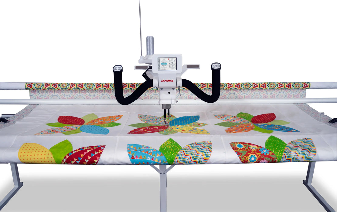 Top-down view of Janome Quilt Maker 15 long arm quilting machine with dual handles and fabric rollers on 8-foot frame