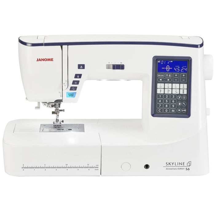 Janome Skyline S6 Anniversary Edition sewing machine front view showing LCD screen, needle area, and extended workspace.