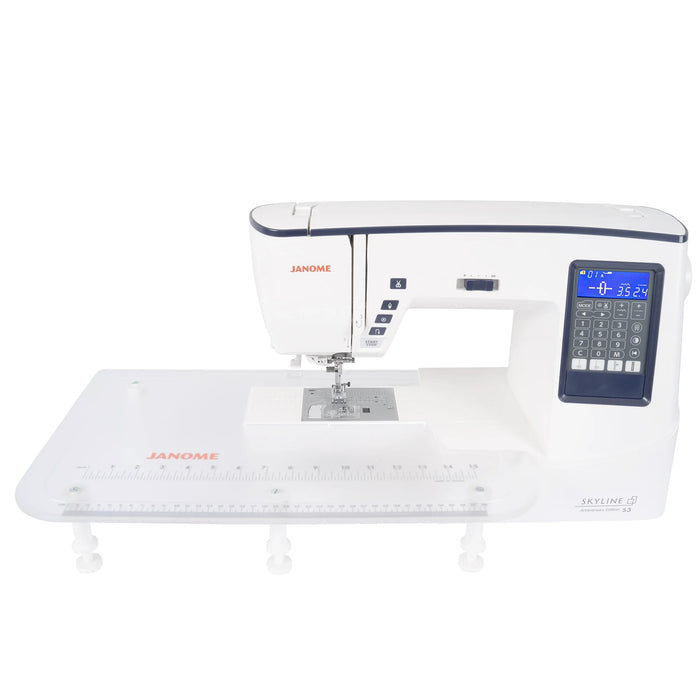 Janome Skyline S3 Anniversary Edition sewing machine with large extension table attached for quilting and sewing projects.
