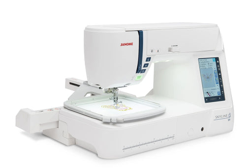 Janome Skyline S9 embroidery machine in action with hoop attachment and wireless design display on screen.