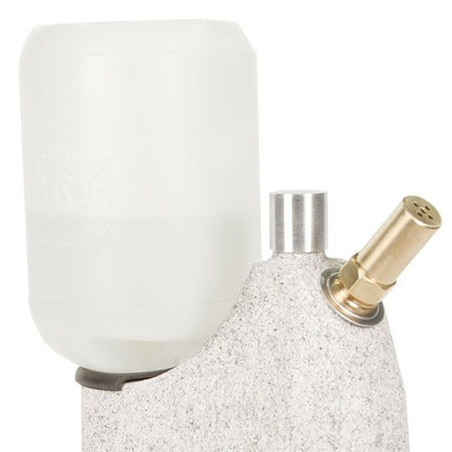 Close-up of Jiffy J-1 Original Hat Steamer water reservoir and brass steam nozzle