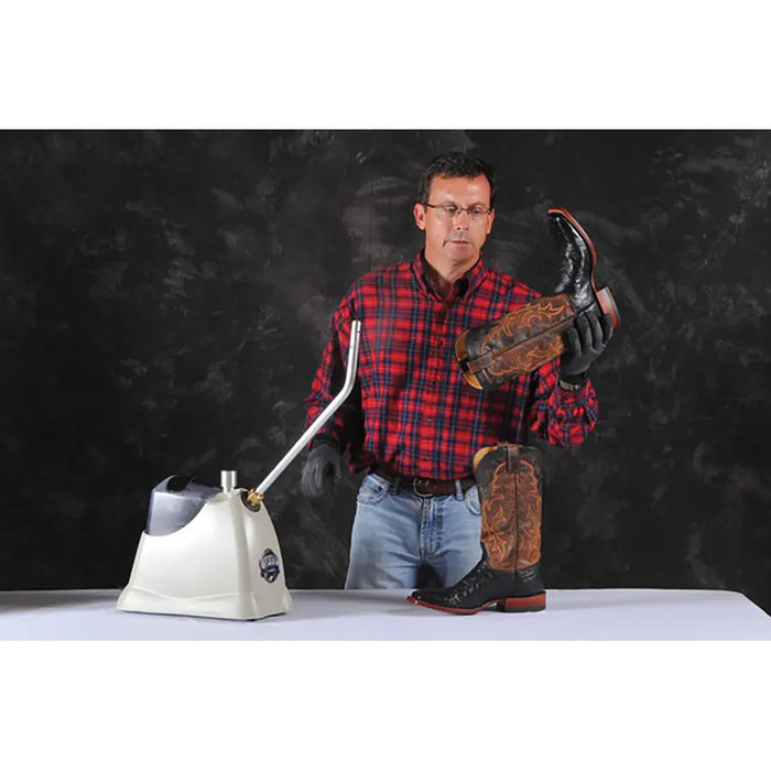 Jiffy Pro-Line SteamBreaker J-4000SBR in use as a technician steams and softens leather cowboy boots for a custom fit.
