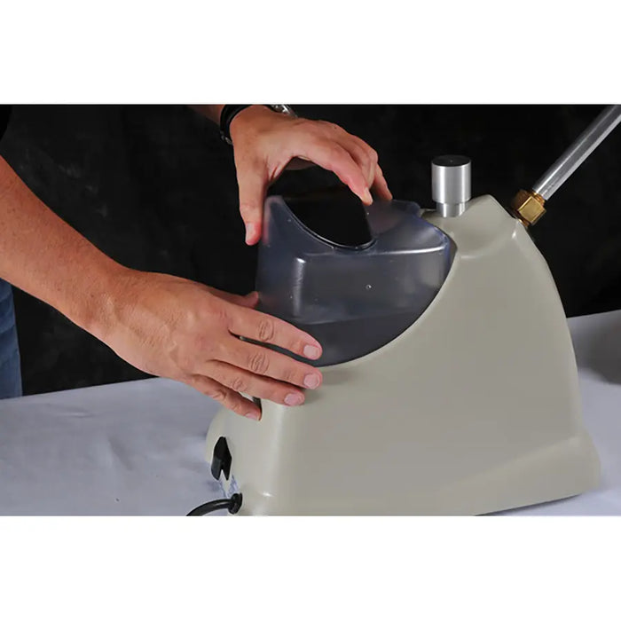 Inserting filled water tank into Jiffy 2535 J-2000SBR SteamBreaker base