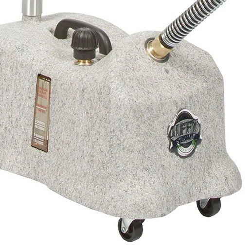 Close-up of the Jiffy J-4000W wig steamer base showing water gauge, brass fittings, and caster wheels.
