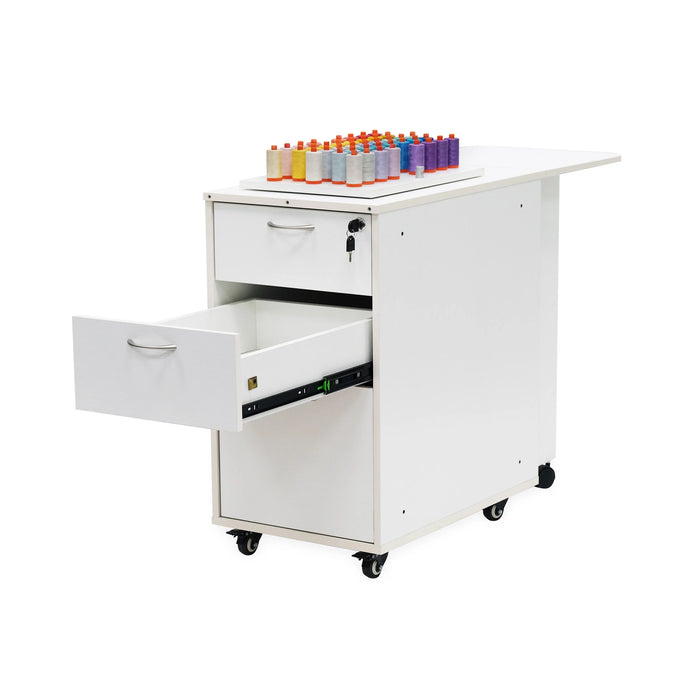 Adelaide Storage Cabinet K4731 in Ash White with top drawer open and colorful thread collection displayed on upper work surface.