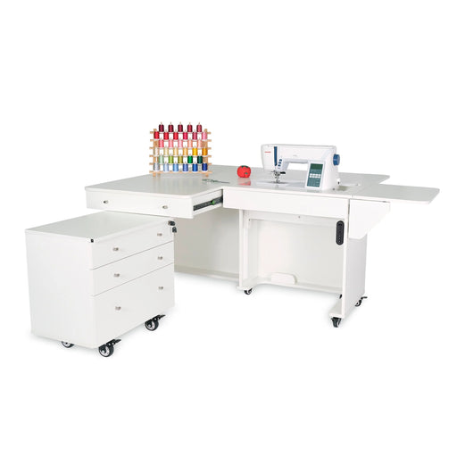 White electric lift sewing cabinet with rolling Joey storage caddy and extended work surface