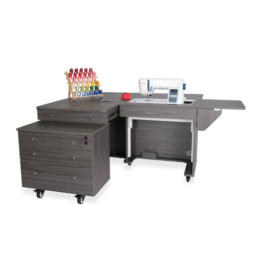 Kangaroo & Joey Sewing Cabinet in modern gray finish with hydraulic lift, expanded work surface, and rolling storage caddy for sewing and quilting studios.