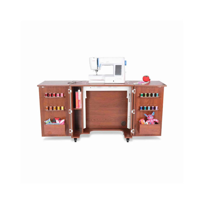 Kangaroo Bandicoot Sewing Cabinet in Teak K8205 shown with hydraulic lift raised, sewing machine on flatbed surface, and door storage for thread and notions.