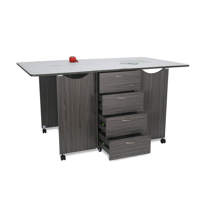 Gray Kangaroo Kookaburra Cutting Table with front drawers open, displaying four spacious storage drawers for sewing tools and craft accessories.
