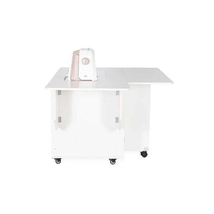 Rear side view of the Kangaroo Melbourne XL Sewing Cabinet in Ash White with sewing machine lowered into the hydraulic lift platform.