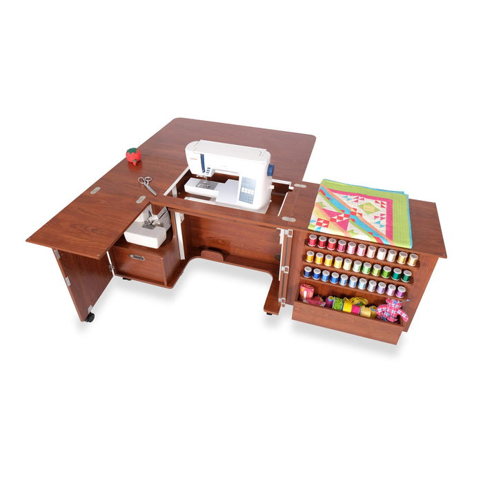 Top view of Kangaroo Wallaby Sewing Cabinet K8405 in Teak featuring hydraulic lift machine opening and expanded quilting work area.