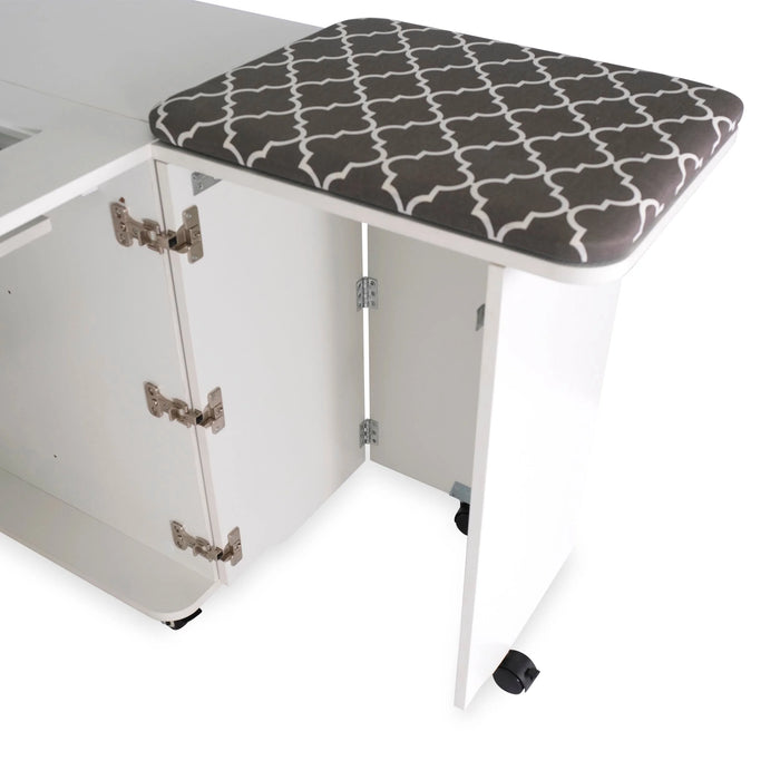 Close-up of ironing and pressing station on the Kangaroo Sydney Electric Sewing Cabinet in white finish with patterned pressing mat.