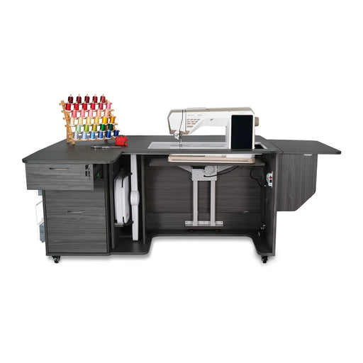 Kangaroo Sydney Lite Dual Rail Electric Sewing Cabinet in gray finish with extended workspace, quilting leaf, storage drawers, and electric lift holding sewing machine.