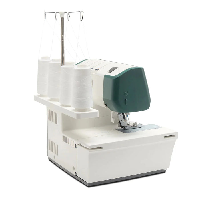 Sewing machine with a white base and green top on a white background