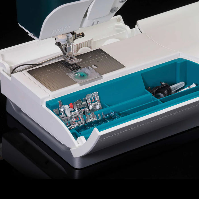 Sewing machine with a clear lid showing components inside on a black background
