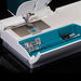 Sewing machine with a clear lid showing components inside on a black background