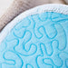Close-up of a blue textured product with a neutral background
