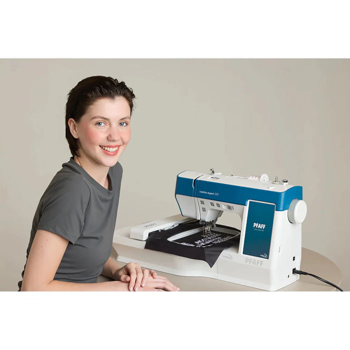 User operating Pfaff Creative Expect 350 embroidery machine stitching custom design on fabric