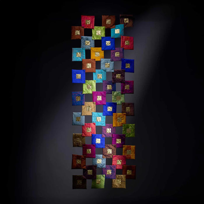 Colorful square tiles arranged in a decorative pattern on a dark background