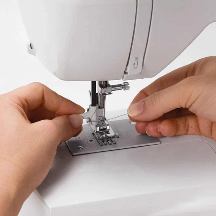 Close-up of built-in needle threader on SINGER Brilliance 6180 sewing machine for easy threading