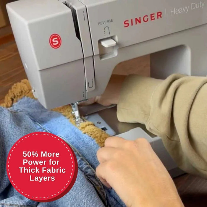 SINGER Heavy Duty 4452 sewing through thick denim fabric highlighting powerful motor and heavy-duty performance