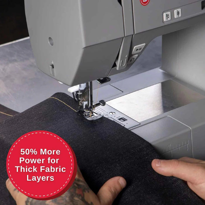 SINGER Heavy Duty 6800C sewing through thick fabric layers with powerful motor and precision needle