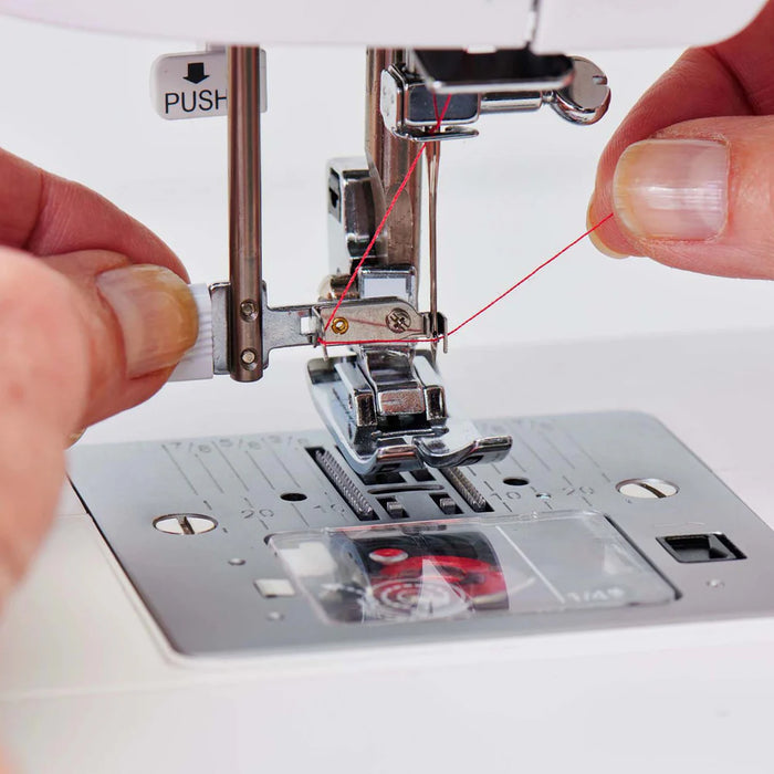 Built-in needle threader on SINGER Elite ME457 sewing machine demonstrating easy threading for faster setup