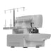 SINGER S0100 serger angled rear side view highlighting thread stand, looper area access, and ventilation panel