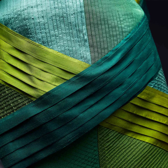 Close-up of green fabric with pleated texture