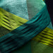 Close-up of green fabric with pleated texture