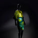Mannequin wearing a green and yellow dress against a dark background