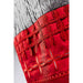 Red fabric with intricate lace-like pattern on a white background