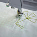 Sewing projection grid and stitch placement guide displayed on fabric while quilting with the EPIC QUILT 97 sewing machine