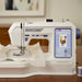 Husqvarna Viking Designer Quartz 29 embroidery machine with 7 inch color touchscreen showing embroidery design editing