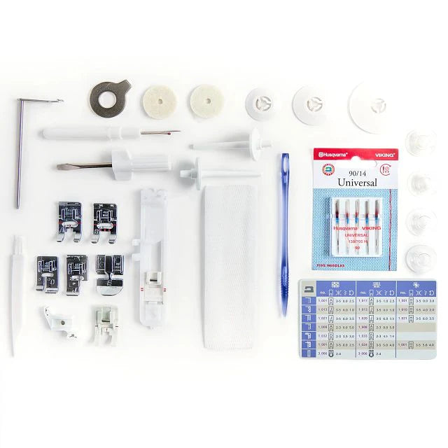 Husqvarna Viking Designer Quartz 29 sewing machine accessories including presser feet, needles, bobbins, tools, and stitch guide