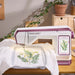 Husqvarna Viking Designer Topaz 65 embroidery machine stitching detailed floral embroidery design on fabric