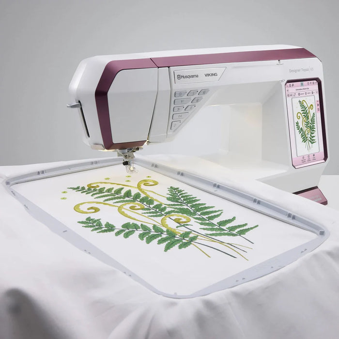 Close-up of Husqvarna Viking Designer Topaz 65 large embroidery hoop creating decorative embroidery pattern