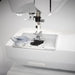Husqvarna Viking Opal 670 sewing machine needle plate and top-loading bobbin area with LED lighting