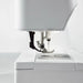 Close-up of a sewing machine on a white background